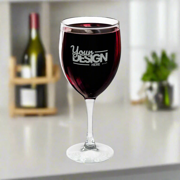 Wine glass with red wine and 'Your Design Here' text on a white background