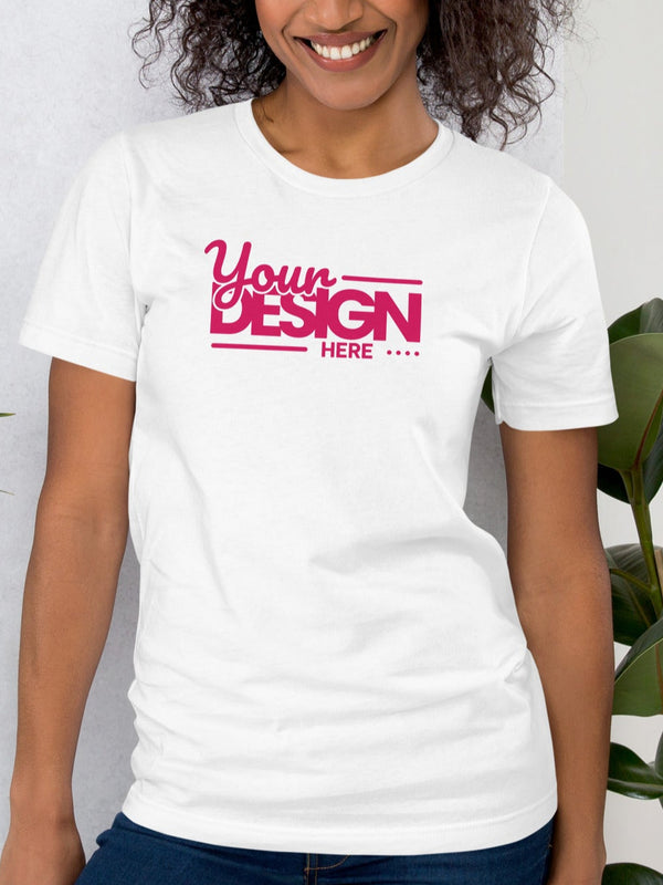 Person wearing a white t-shirt with 'Your Design Here' text, standing between two plants against a light background