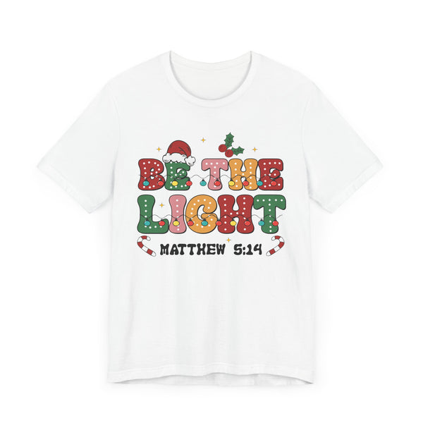 Be the Light Christmas T-Shirt - Colorful Holiday Design with Santa Hat and Lights - Festive Cheerful Apparel