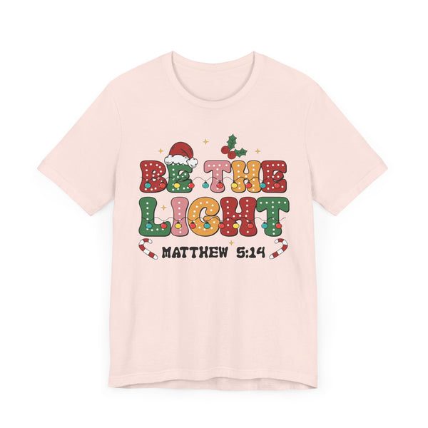 Be the Light Christmas T-Shirt - Colorful Holiday Design with Santa Hat and Lights - Festive Cheerful Apparel