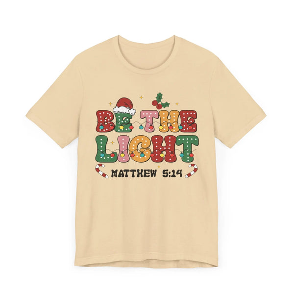 Be the Light Christmas T-Shirt - Colorful Holiday Design with Santa Hat and Lights - Festive Cheerful Apparel